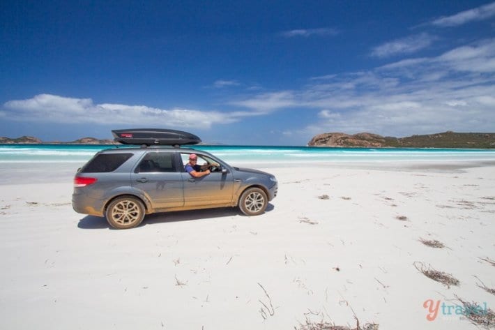 A car parked on a beach