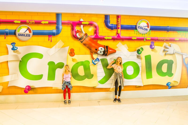 girls posing in front of Crayola sign Mall of America