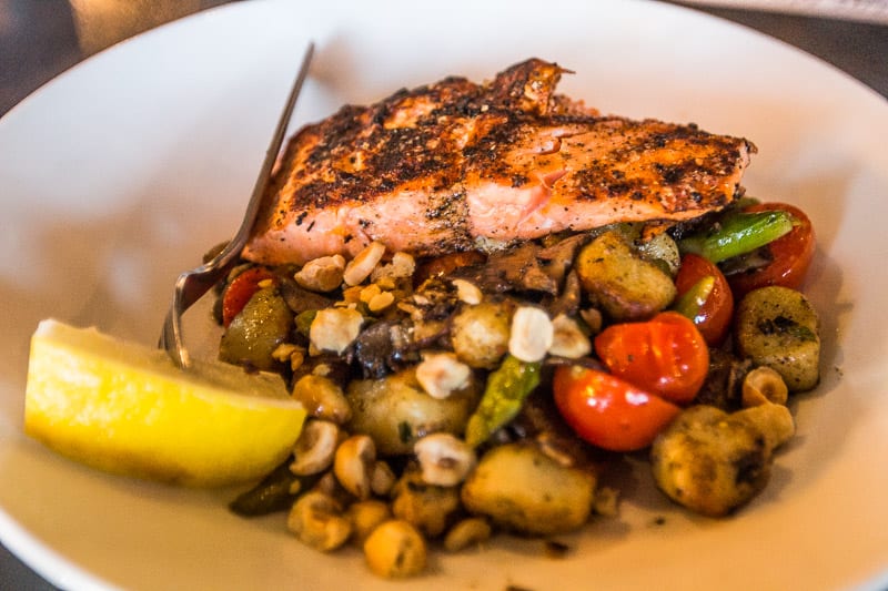 A plate of salmon and brussel sprouts