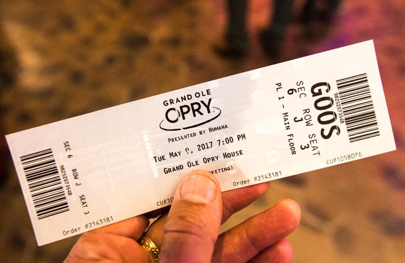 person holding Tickets to the Grand Ole Opry Show 