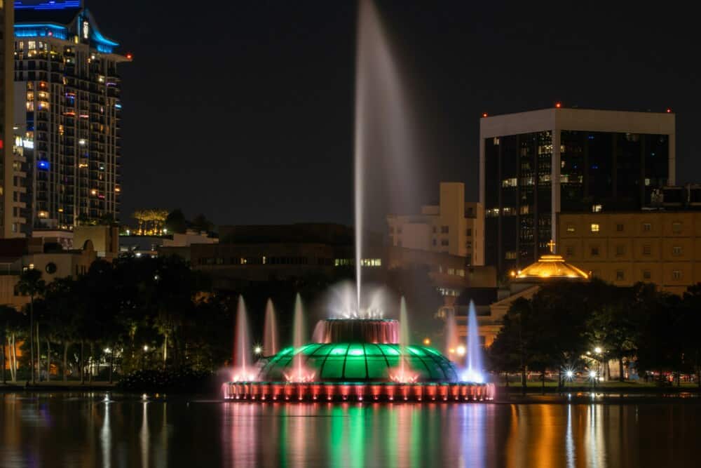 fountain Lake Eola Park at night in neon lights