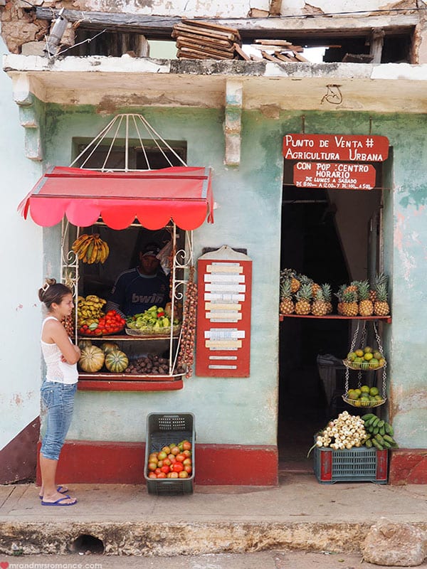 person standing in front of a fruit stand