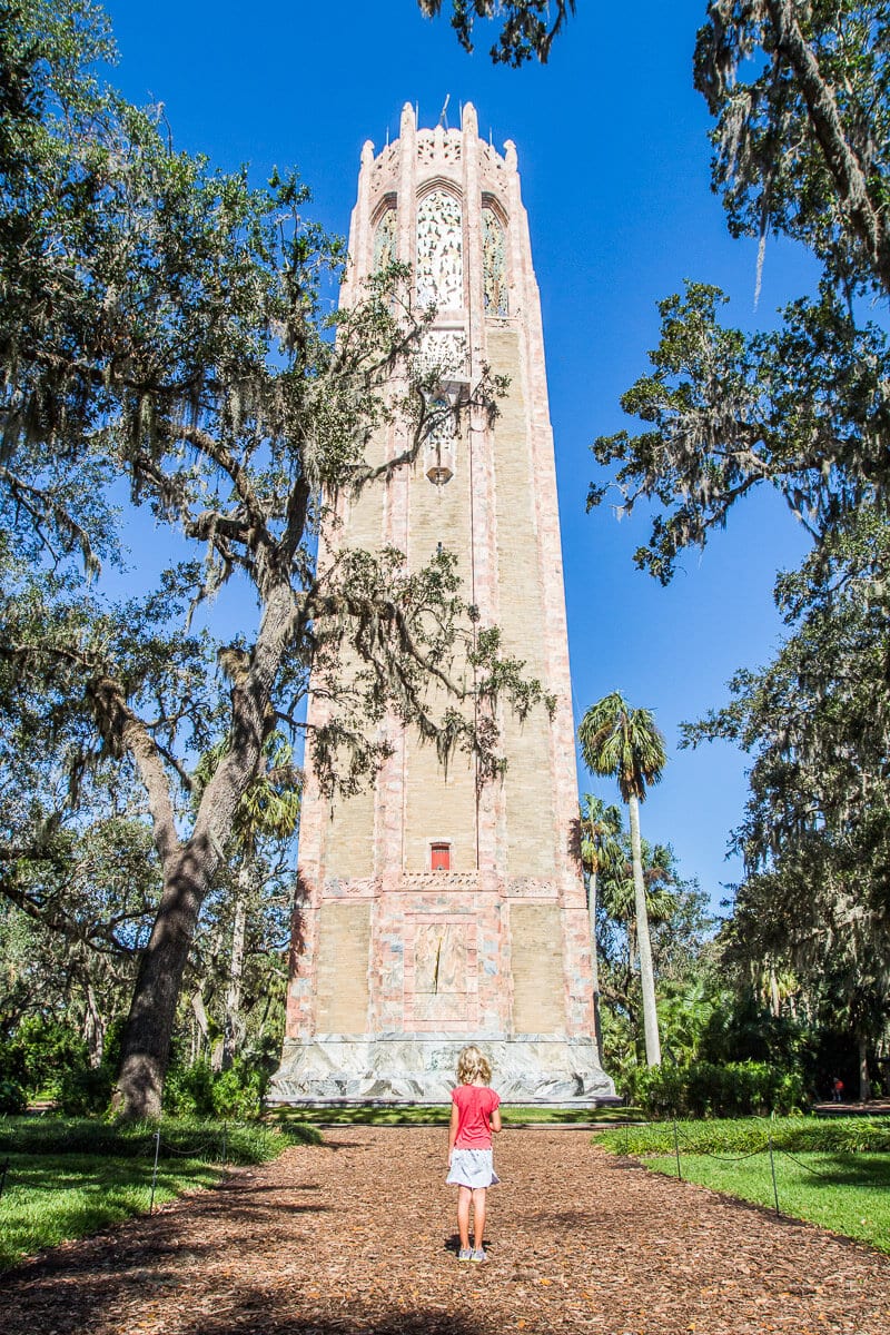 girl looking up at Bok Tower 