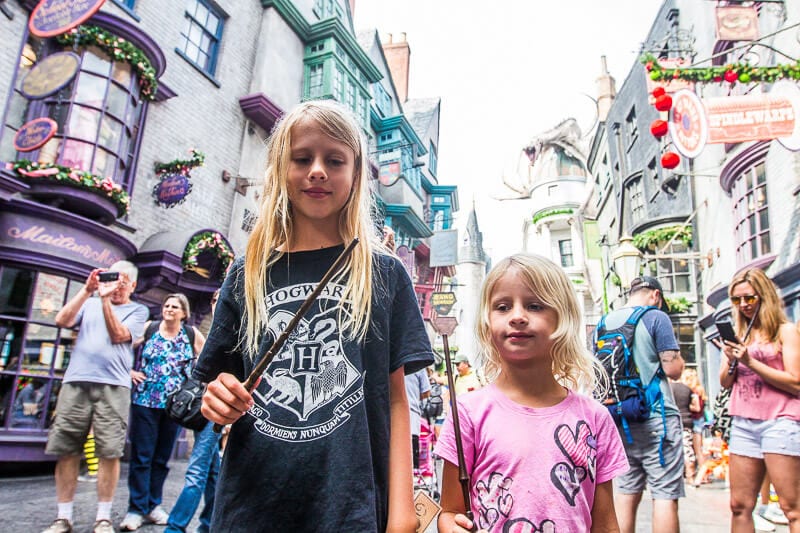 girls holding wands Diagon Alley at Universal Studios Orlando