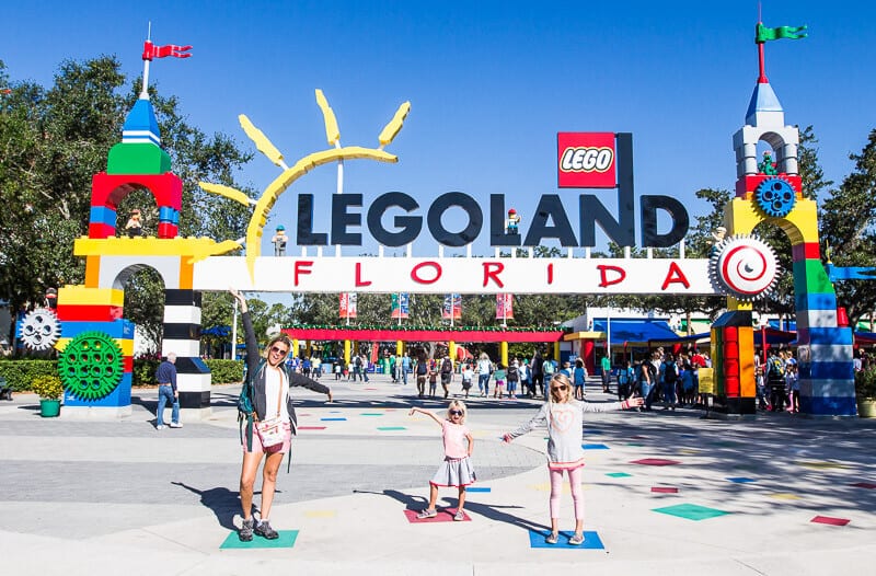 family posing in front of Legoland Florida entrance