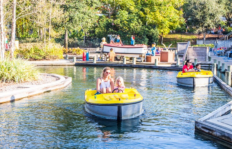 people in small boats