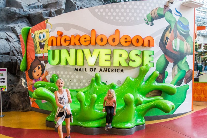 two girls posing out front of Nickelodeon Universe, Mall of America