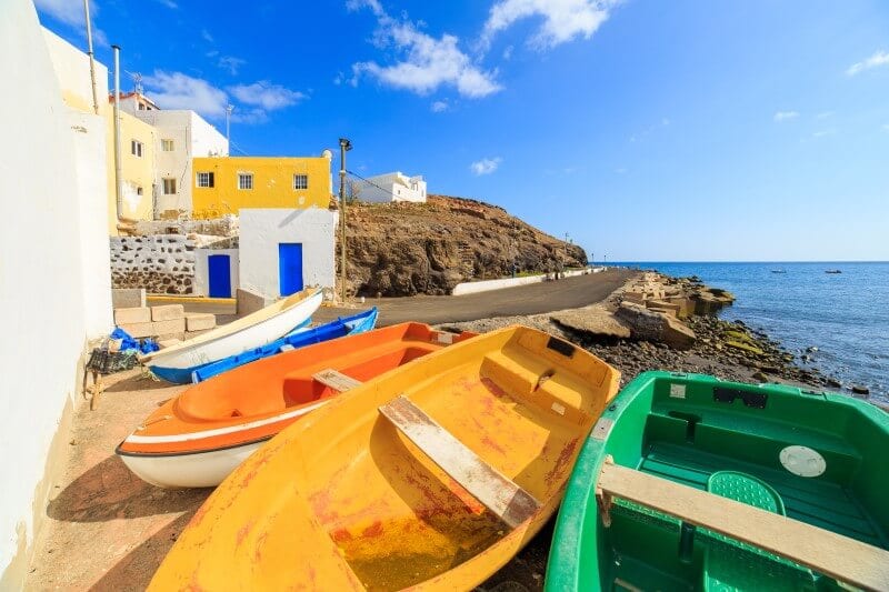 colorful boats by the shore in cuba