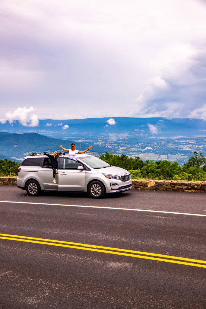 woman standing outside car on Skyline Drive, Shenandoah National Park