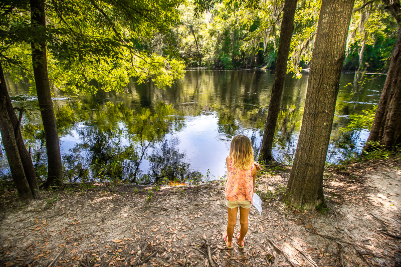 girl on trail looking at suwannee river